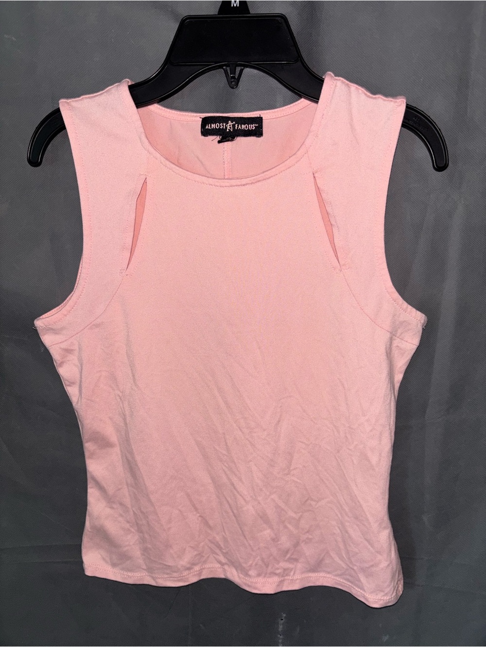 Sz S pink Almost Famous tank crop top features unique cut-out details